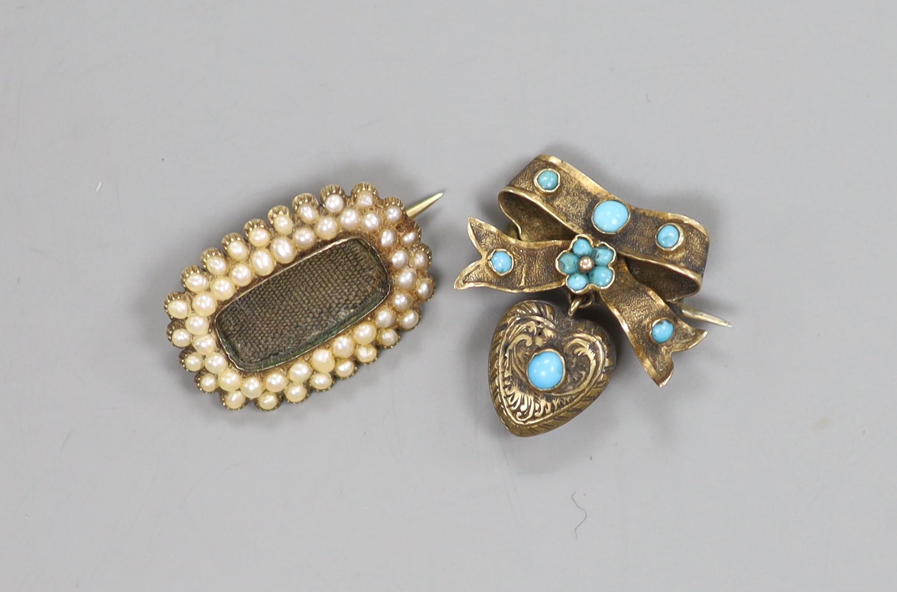 A Victorian yellow metal and seed pearl set mourning brooch, with engraved inscription and a brooch.